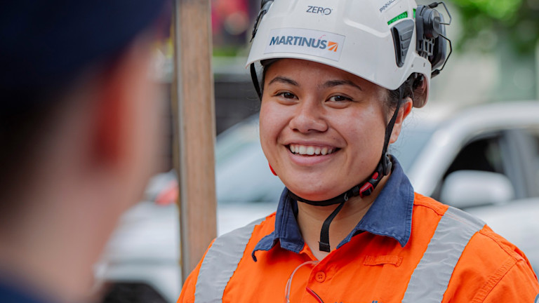 A Martinus contractor smiling to another contractor